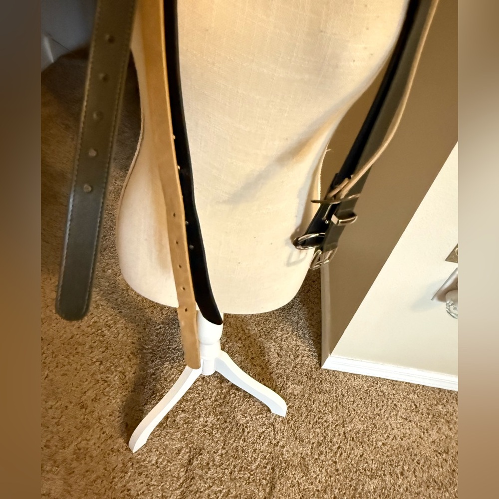 A four assorted belts. Size XL. One sand one tan two black.
